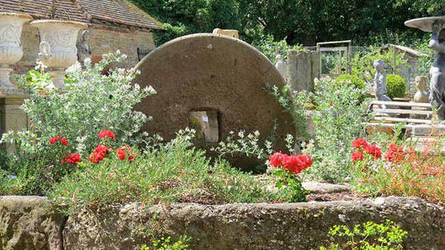Holloways cider mill stone make for great garden centrepieces